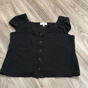 black shirt- scrunched shoulder bottom down front